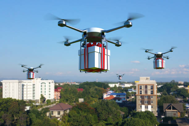 istock Drone with white gift box flying over the town. 656305506
