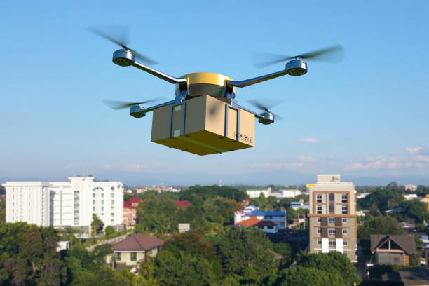 istock Delivery drone with the cardboard box flying over the town. 656305578