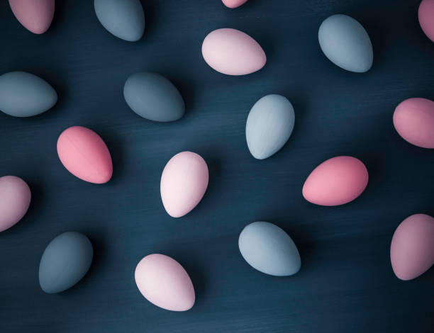 istock Hand painted gray and pink ombre Easter eggs background 656314654