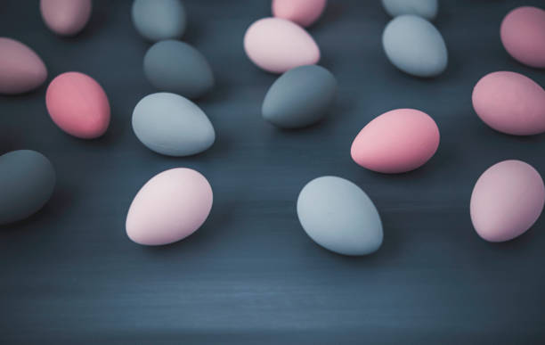 istock Hand painted gray and pink ombre Easter eggs background 656315080