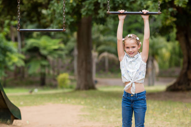 istock Girl hanging on a playing equipment in park 656315568