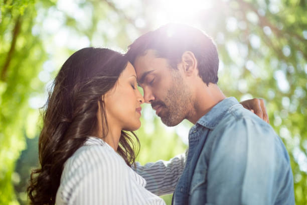 istock Couple romancing in park 656315694