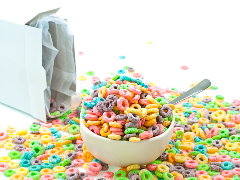 Cereal loops mess in bowl isolated on white background