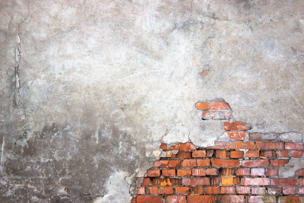 istock urban background of a brick wall with destroyed stucco 656324786