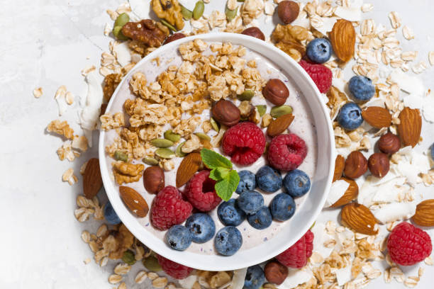 istock homemade muesli with yogurt and berries, top view 656325024