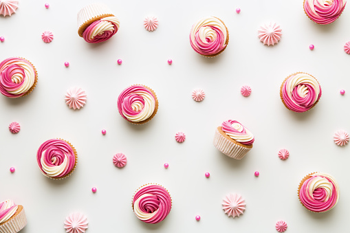 Pink cupcake background on white