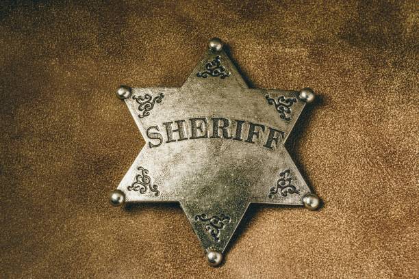 istock Sheriff badge on brown leather texture background. 656328106
