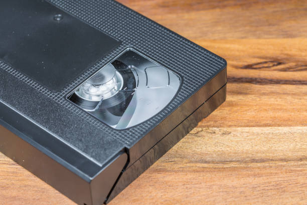istock Vintage Video Cassette on Wooden Background 656329256