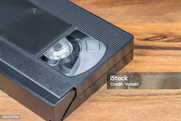 Vintage Video Cassette On Wooden Background Stock Photo - Download Image Now - Collection, Videocassette, 1980