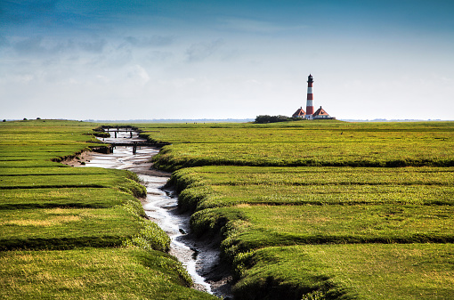 Beautiful landscape with famous Westerheversand lighthouse in the background at North Sea in Nordfriesland, Schleswig-Holstein, Germany