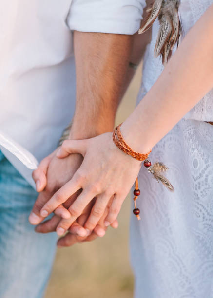 istock the young loving couple holds hands outdoors, close up. hippie, boho style 656333232
