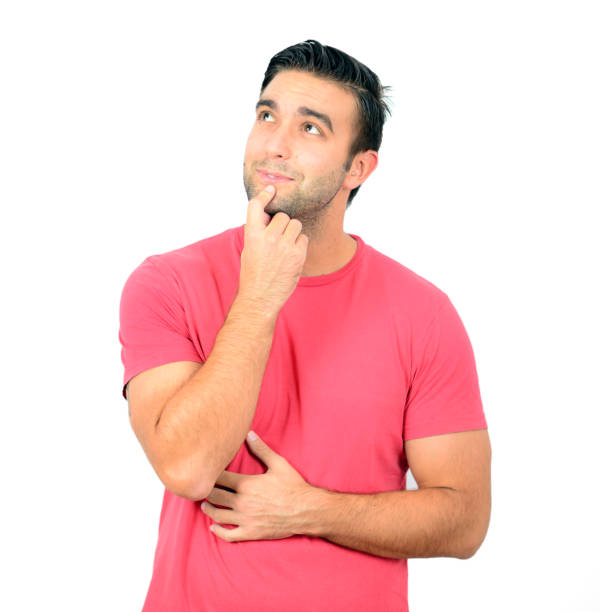 istock Closeup of young man looking up thinking on white background 656339414