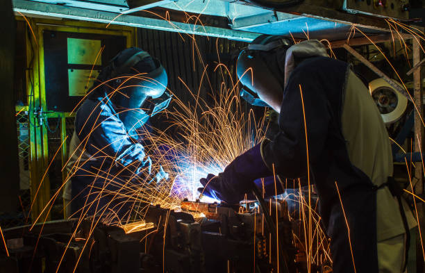 istock Worker,welding in a car factory with sparks 656340132
