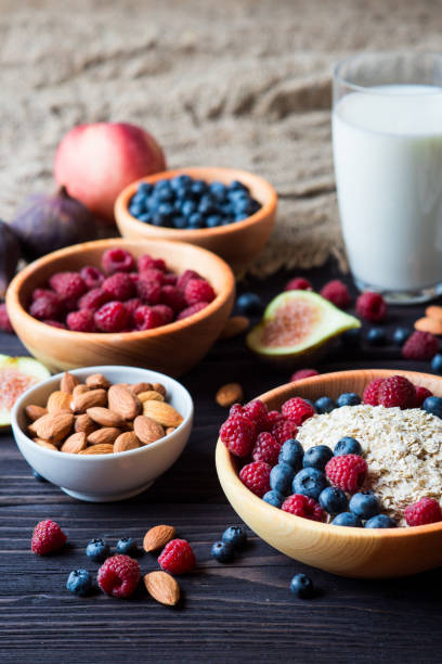 istock Breakfast table with porridge oats, berries and nuts 656340182