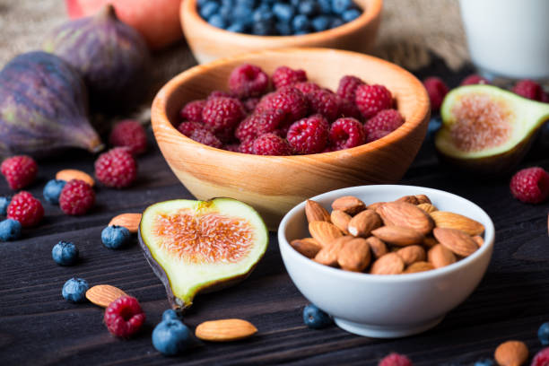 istock Bowl with berries, figs and almond nuts 656340244