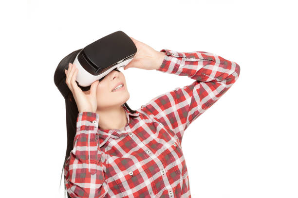 istock Girl in headset of VR watching video 656342450