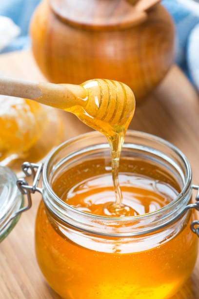 istock Honey in glass jar 656349174