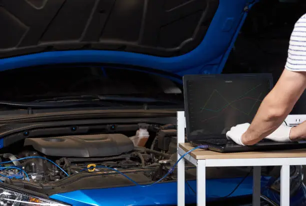 Changing car engine setting. Tuning car engine on computer