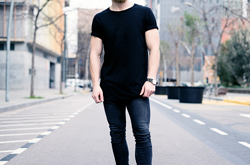 Young Muscular Man Wearing Black Tshirt And Jeans Posing On The Street Of  The Modern City Blurred Background Hotizontal Mockup Stock Photo - Download  Image Now - Istock