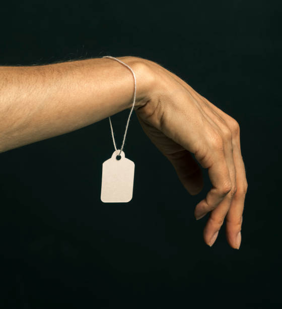 istock slavery concept hand with price tag 656350446