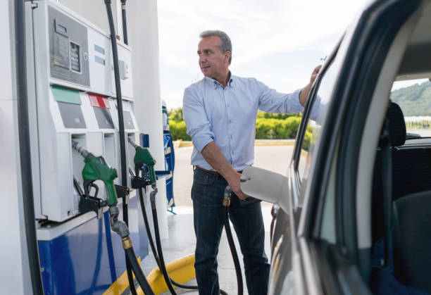 istock Man refueling his car at a petrol station 656353202