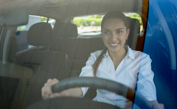 istock Young woman driving a car 656353220
