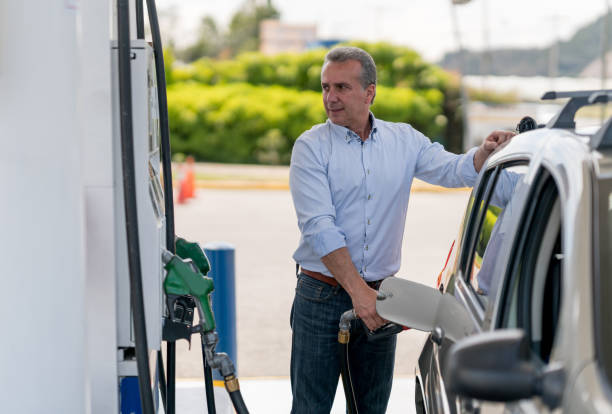 istock Man refueling his car at a gas station 656353406