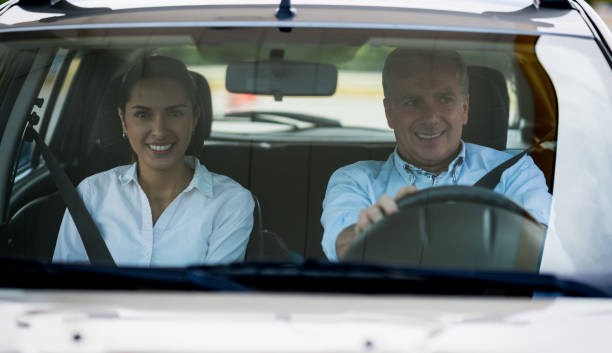 istock Man driving a car with a passenger 656353420