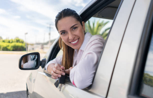 istock Happy woman driving a car 656353502
