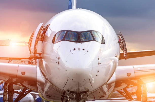 istock Airplane view from the front cockpit fuselage at sunset at the airport 656357720