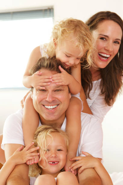 istock Beautiful young family smiling at home 656364270