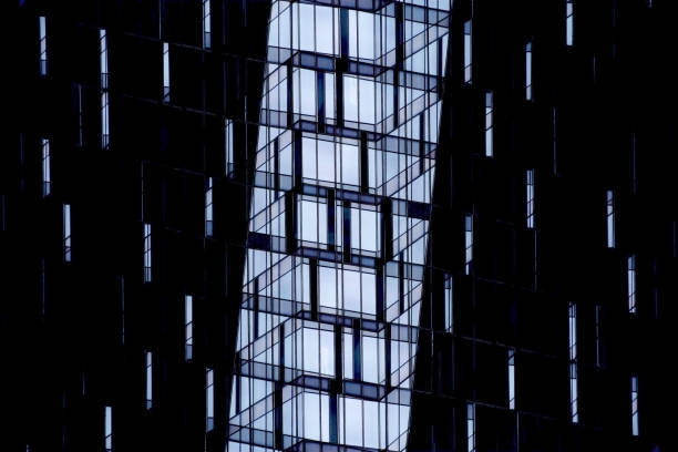 istock Double exposure photo of high-rise office building / skyscraper midsection with dark and light parts. Grunge abstract image on the subject of modern architecture, construction industry or technology. 656364522