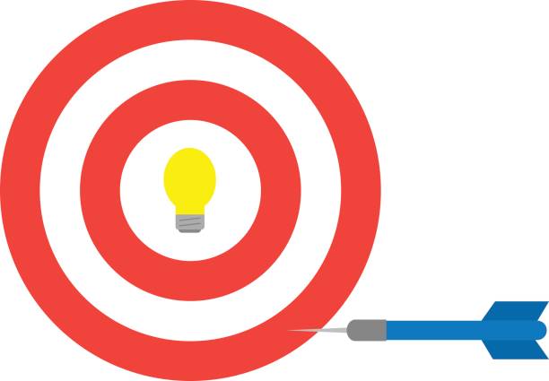 Bullseye with light bulb and dart Vector red bullseye with yellow light bulb and blue dart. bulls eye photos stock illustrations
