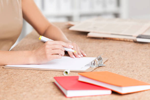 istock Side view of woman’s hands with marker 656367056