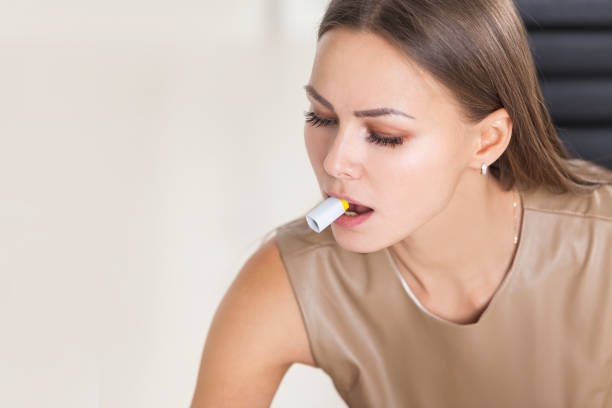 istock Close up of a designer with marker cap in mouth 656370178