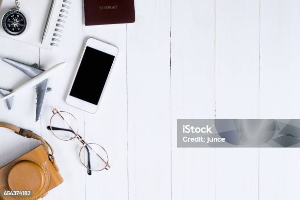 Travel Objects Flatlay On White Wooden With Copy Space Stock Photo - Download Image Now