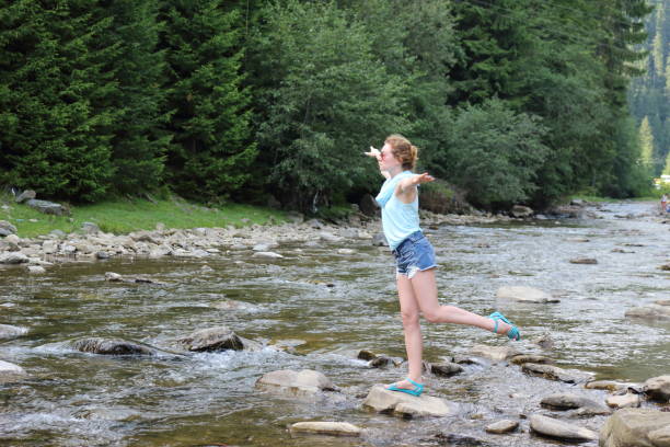 istock Woman in a mountain`s river. 656374196