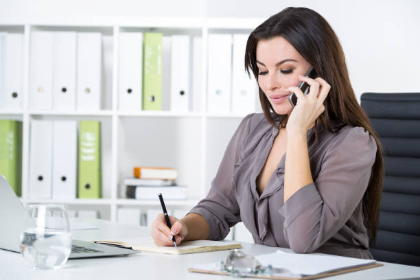 istock Woman in gray on her phone 656374438