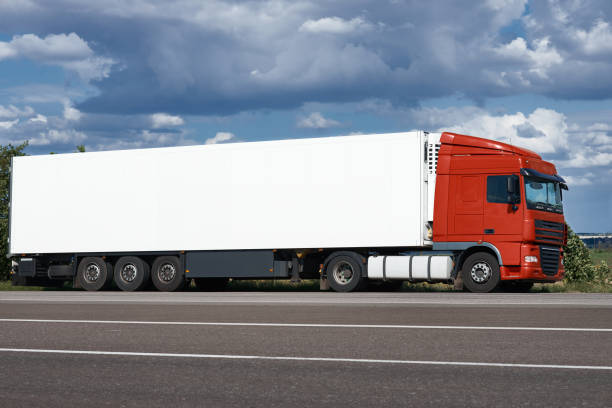 istock Truck on road with white blank container, blue sky, cargo transportation concept 656381666