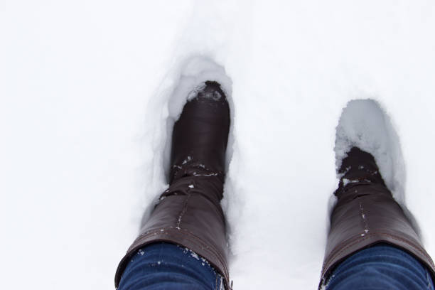 istock Leather Brown Boots in the snow. 656394906