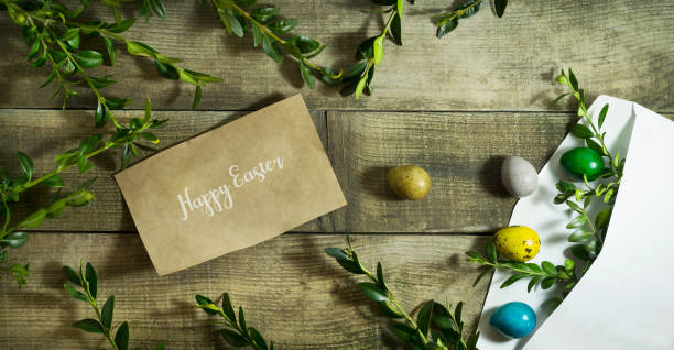 istock Easter colored eggs in a postal envelope on a wooden background 656402348