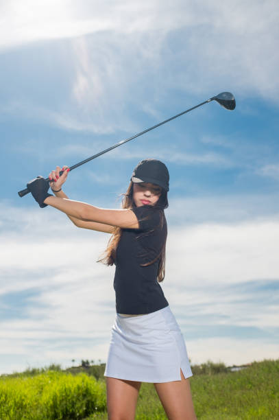 istock Young Hispanic Women Hitting A Golf Ball 656402412