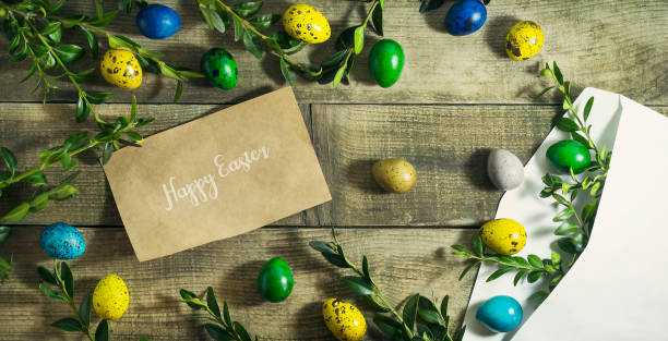 istock Easter colored eggs in a postal envelope on a wooden background 656402428