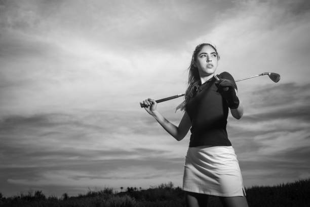 istock Young Hispanic Women Golfer Posing With Two Irons 656402492