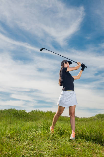 istock Young Hispanic Women Hitting A Golf Ball 656402716