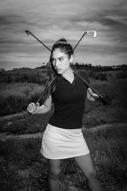istock Young Hispanic Women Golfer Posing With Two Irons 656410126