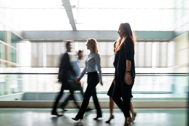 istock Business people walking through the lobby. 656410532