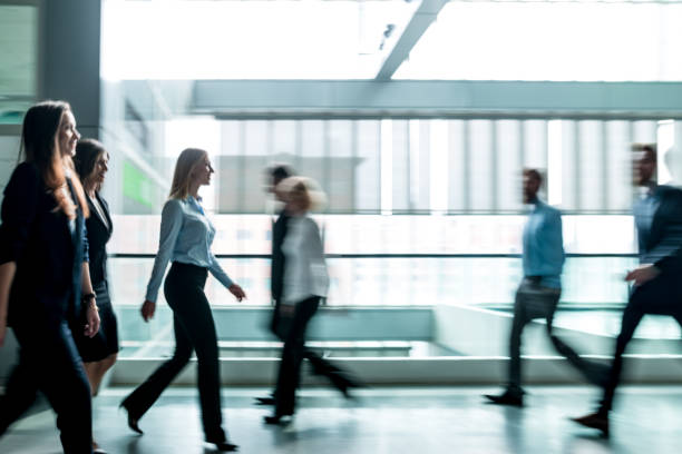 istock Business people walking through the lobby. 656410548
