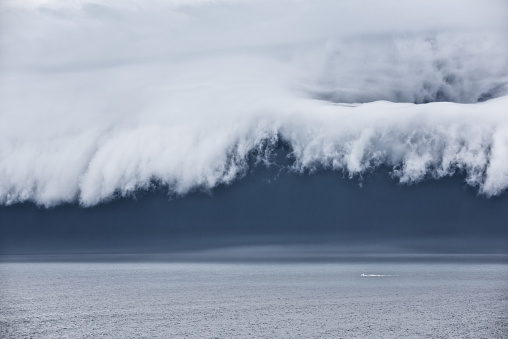 Epic supercell shelf cloud, Small boat fleeing