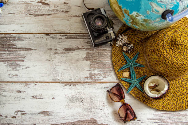 travel items on wooden background